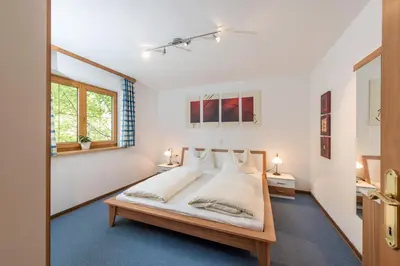 Ein Bett oder Betten in einem Zimmer der Unterkunft Landhaus Bergzeit