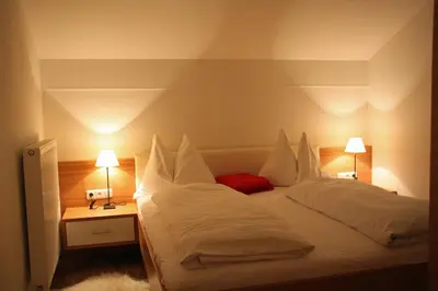 Ein Bett oder Betten in einem Zimmer der Unterkunft Pension Café Maier