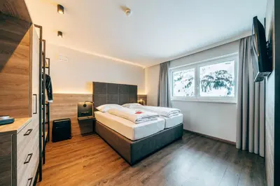 Ein Bett oder Betten in einem Zimmer der Unterkunft FOXY Obertauern