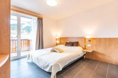 Ein Bett oder Betten in einem Zimmer der Unterkunft Chalet Dorf Wagrain Alpenleben by AlpenTravel