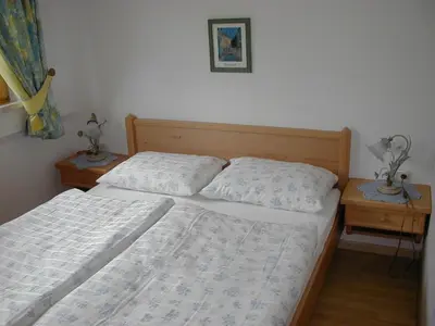 Ein Bett oder Betten in einem Zimmer der Unterkunft Ferienwohnung Maria Gstatter