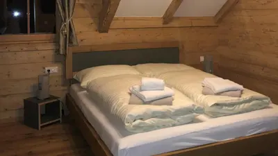 Ein Bett oder Betten in einem Zimmer der Unterkunft Mankerl Hütte Lachtal