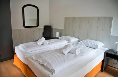 Ein Bett oder Betten in einem Zimmer der Unterkunft GRASSEGGER APPARTEMENTHAUS