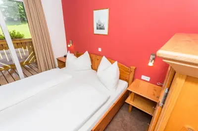 Ein Bett oder Betten in einem Zimmer der Unterkunft Berghoam - inklusive Wasserwelt