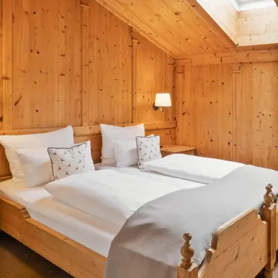 Ein Bett oder Betten in einem Zimmer der Unterkunft Waldhof Fuschlsee Resort