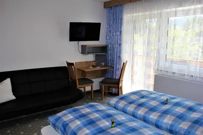 Ein Bett oder Betten in einem Zimmer der Unterkunft Gästehaus Oberauer