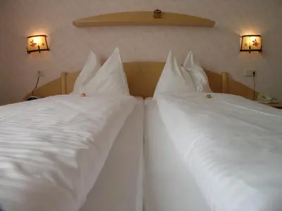 Ein Bett oder Betten in einem Zimmer der Unterkunft Hotel Tischlbergerhof