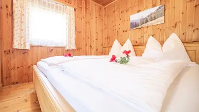 Ein Bett oder Betten in einem Zimmer der Unterkunft Huberbauer