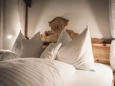 Ein Bett oder Betten in einem Zimmer der Unterkunft Gasthof - Pension Ödsteinblick