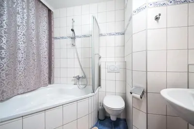 Ein Badezimmer in der Unterkunft Gasthof - Pension Ödsteinblick