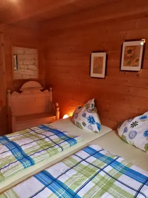 Ein Bett oder Betten in einem Zimmer der Unterkunft Milena-Hütte