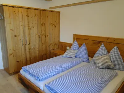 Ein Bett oder Betten in einem Zimmer der Unterkunft Appartement Gipfelsturm