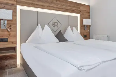 Ein Bett oder Betten in einem Zimmer der Unterkunft Rainerhof