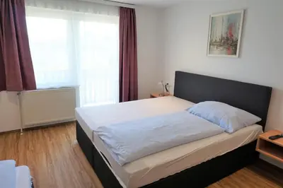 Ein Bett oder Betten in einem Zimmer der Unterkunft Hotel Wahlmüller
