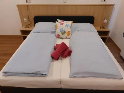 Ein Bett oder Betten in einem Zimmer der Unterkunft Hotel Wahlmüller