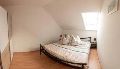 Ein Bett oder Betten in einem Zimmer der Unterkunft Ferienwohnung Michael