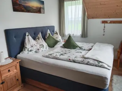 Ein Bett oder Betten in einem Zimmer der Unterkunft Haus Heimatblick