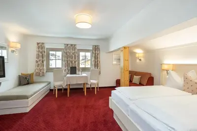 Ein Bett oder Betten in einem Zimmer der Unterkunft Hotel Tauernblick