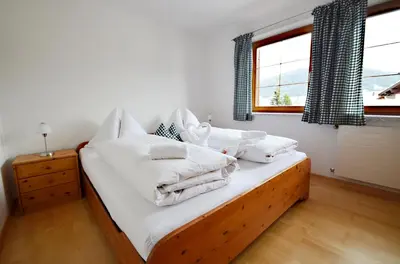 Ein Bett oder Betten in einem Zimmer der Unterkunft Appartements Mantinger