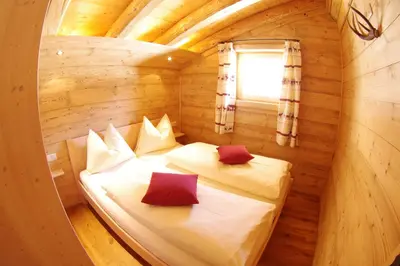 Ein Bett oder Betten in einem Zimmer der Unterkunft Almchalet Alpenflora