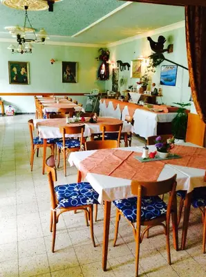 Ein Restaurant oder anderes Speiselokal in der Unterkunft Mooswirt