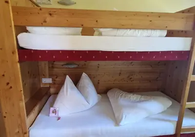 Ein Bett oder Betten in einem Zimmer der Unterkunft FEWO Gabi Haus Pacher