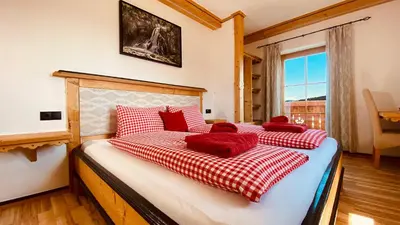 Ein Bett oder Betten in einem Zimmer der Unterkunft Bio Alpenhof Rostatt