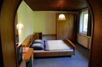 Ein Bett oder Betten in einem Zimmer der Unterkunft Strandhotel