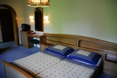 Ein Bett oder Betten in einem Zimmer der Unterkunft Strandhotel
