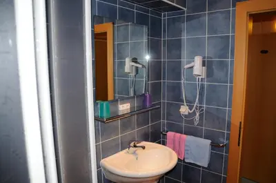 Ein Badezimmer in der Unterkunft Strandhotel
