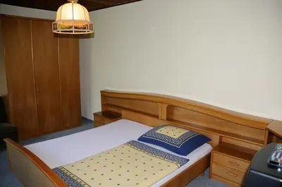 Ein Bett oder Betten in einem Zimmer der Unterkunft Strandhotel