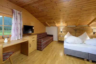 Ein Bett oder Betten in einem Zimmer der Unterkunft Walchauhof