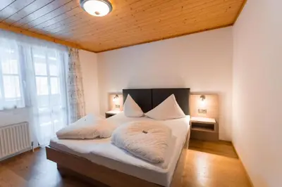 Ein Bett oder Betten in einem Zimmer der Unterkunft Pension Walchauhof
