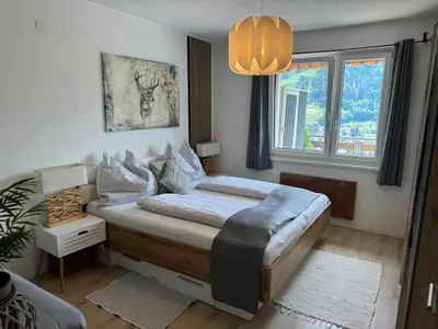 Ein Bett oder Betten in einem Zimmer der Unterkunft Schnelli Appartement Schladming