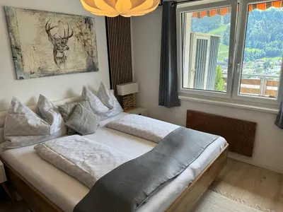 Ein Bett oder Betten in einem Zimmer der Unterkunft Schnelli Appartement Schladming