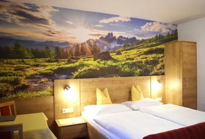 Ein Bett oder Betten in einem Zimmer der Unterkunft Pension Vocario