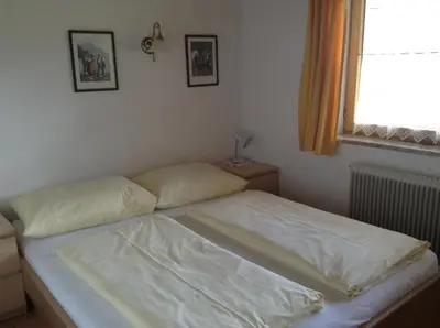 Ein Bett oder Betten in einem Zimmer der Unterkunft Ferienhaus Bergland