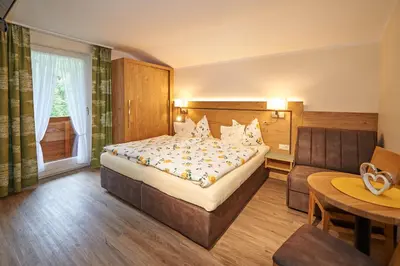Ein Bett oder Betten in einem Zimmer der Unterkunft Haus Alpenheim