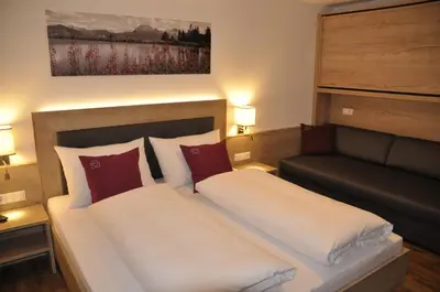 Ein Bett oder Betten in einem Zimmer der Unterkunft Herzis Appartements