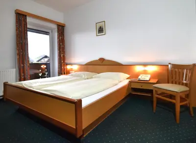 Ein Bett oder Betten in einem Zimmer der Unterkunft Hotel&Wirtshaus Sonne