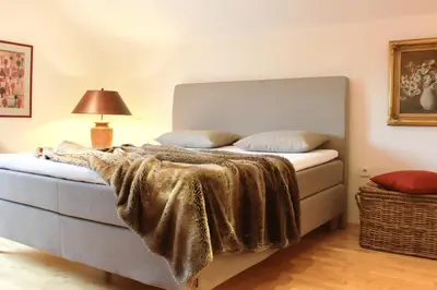Ein Bett oder Betten in einem Zimmer der Unterkunft Ferienhaus Alpennest