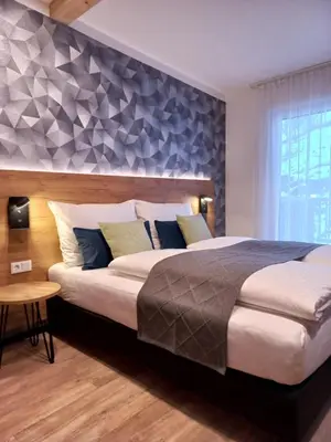 Ein Bett oder Betten in einem Zimmer der Unterkunft Laudach INN