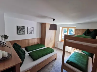 Ein Bett oder Betten in einem Zimmer der Unterkunft Ferienwohnung Hirscher