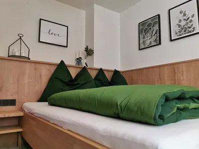 Ein Bett oder Betten in einem Zimmer der Unterkunft Ferienwohnung Hirscher
