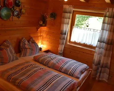 Ein Bett oder Betten in einem Zimmer der Unterkunft Tauern-Hütt'n - Alpenzauber