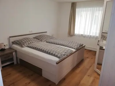 Ein Bett oder Betten in einem Zimmer der Unterkunft Ferienwohnung Schmied 1