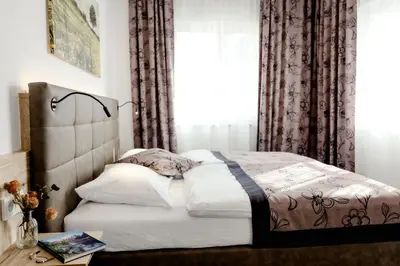 Ein Bett oder Betten in einem Zimmer der Unterkunft Hotel - Restaurant Goisererhof 3S