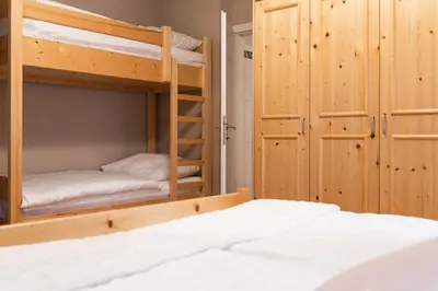 Ein Bett oder Betten in einem Zimmer der Unterkunft Ski in - Ski out Schladming NEM Alpin Chalet