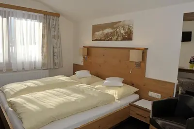 Ein Bett oder Betten in einem Zimmer der Unterkunft Edelweiss Apartments