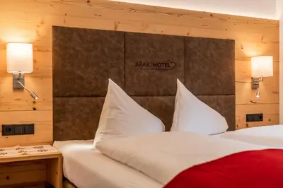 Ein Bett oder Betten in einem Zimmer der Unterkunft Aparthotel Ramsau